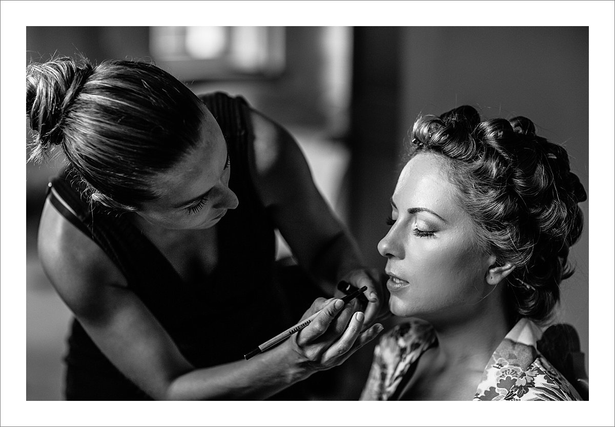 makeup artist working on Anne's makeup