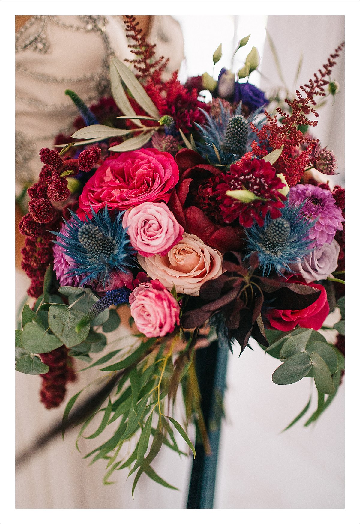 deep burgundy, pink and blue colourful bridal bouquet