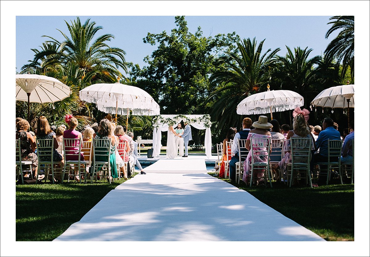 wedding ceremony over a pool in Finca La Concepcion in Marbella